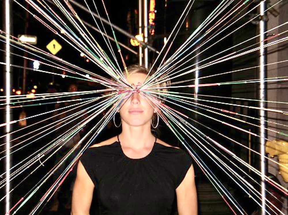 Relational artist Jasmine inside her thread installation, WEAVE offline social club